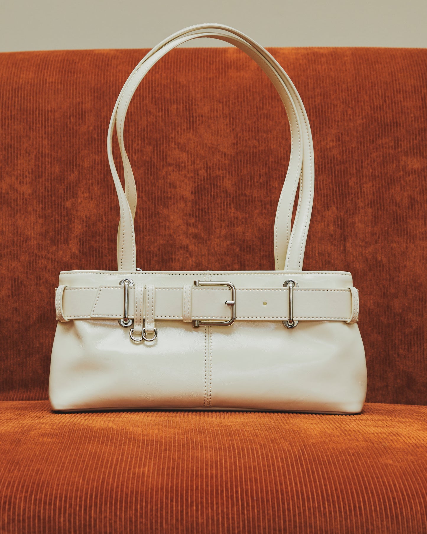 Glint - Belted Patent Leather Shoulder Bag